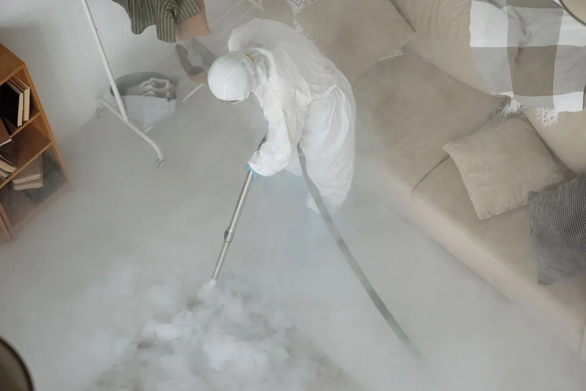 Biohazard cleanup technician in protective equipment, Avis, PA